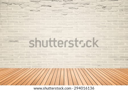 Old interior room with abstract light beige brick wall pattern and brown wood floor in warm tone