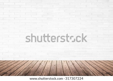 Old interior room with white brick wall texture and brown grunge wood floor pattern, use for background, backdrop or design element
