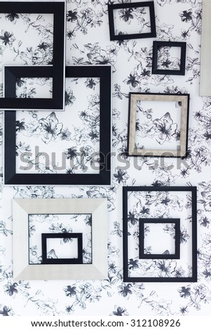 Modern black frame on black flower background.