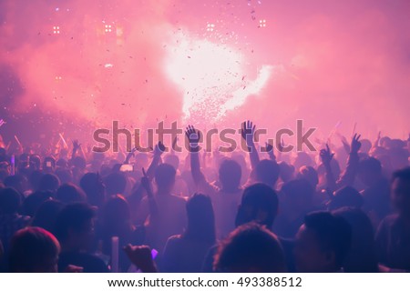 Youth clubs are fun, hands clapping, holds up the phone recording. DJ in clubs that have Music fun. Blurry night club DJ party people enjoy of music dancing sound .  Bangkok RCA Thailand.