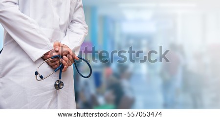Doctor with a stethoscope and  patients waiting for treatment at the hospital. blur blue background.