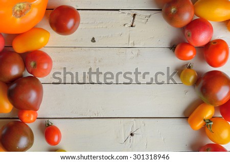 Cherry tomatoes. Cherry tomatoes on vine with water drops.  Copy space composition
