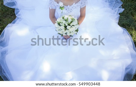 Wedding bouquet holding groom, elegant flowers