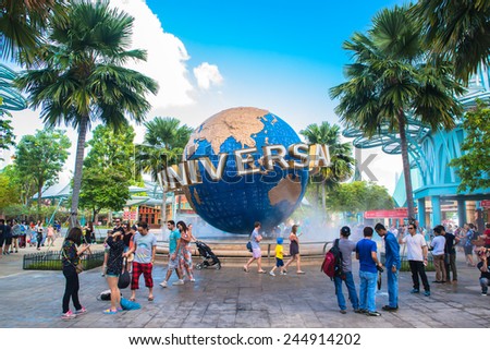 SINGAPORE - JANUARY 13  Tourists and theme park visitors taking pictures of the large rotating globe fountain in front of Universal Studios on January 13, 2015 in Sentosa island, Singapore