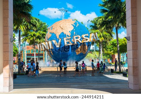 SINGAPORE - JANUARY 13  Tourists and theme park visitors taking pictures of the large rotating globe fountain in front of Universal Studios on January 13, 2015 in Sentosa island, Singapore