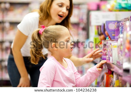 mother and daughter shopping for toys