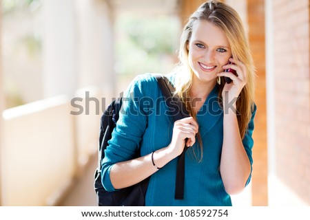 beautiful young female university student talking on the smart phone