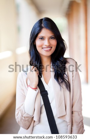 beautiful female college student with shoulder bag
