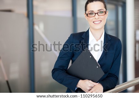 attractive young businesswoman portrait in office