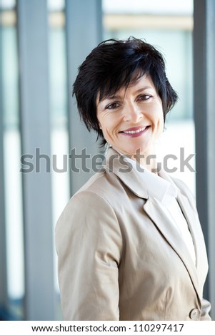 happy middle aged businesswoman portrait in office