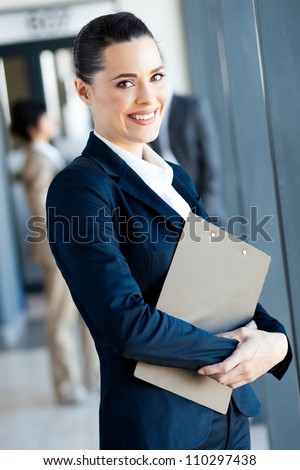 cute young businesswoman portrait in office