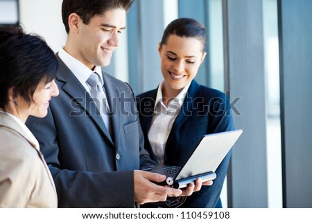 group of business people using laptop
