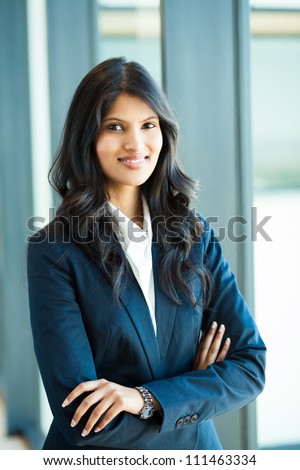 attractive female white collar worker in office