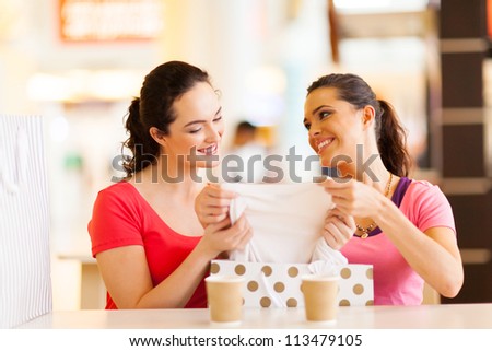 young women checking clothes that just bought