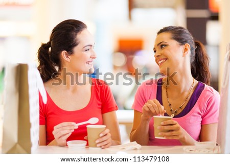 two happy friends having drinks in cafe two happy friends having drinks in cafe