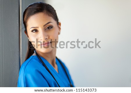 beautiful female healthcare worker closeup portrait in office