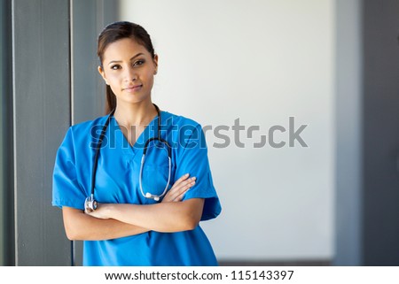 attractive young medical intern portrait in office