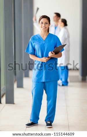 happy young nurse full length portrait
