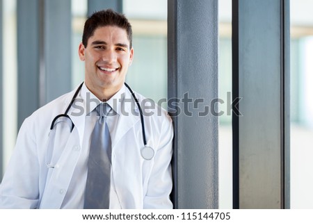 happy young medical doctor portrait in office