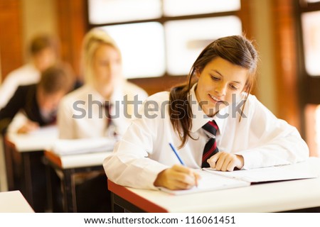 Group Of High School Students Studying In Classroom