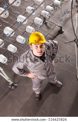 textile factory worker looking up