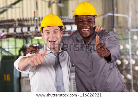 factory manager and worker thumbs up