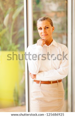 elegant female senior corporate worker in office