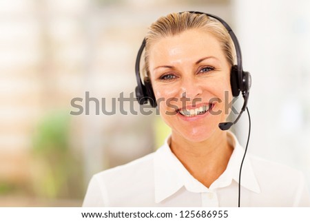 happy middle aged businesswoman with headphones