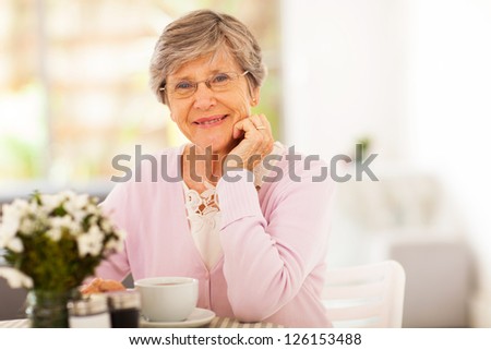 elegant senior woman having tea