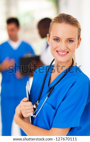 beautiful medical worker holding tablet computer in hospital