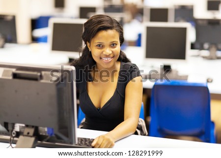 beautiful female african american college student in computer room