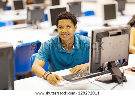 male african college student in computer room