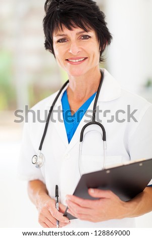 beautiful mature medical nurse portrait in office