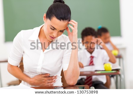 elementary school female teacher feeling sick in classroom