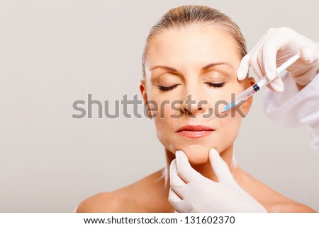 cosmetic injection to mature woman face
