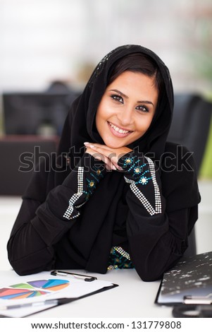 pretty female Arabian corporate worker portrait in office