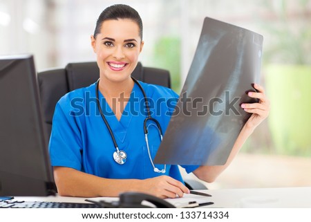 female medical doctor with a x-ray in hospital office