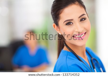 closeup portrait of young female medical worker in office
