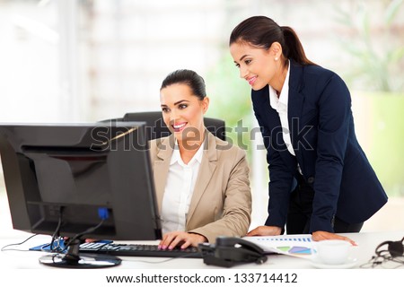 attractive business women working using computer