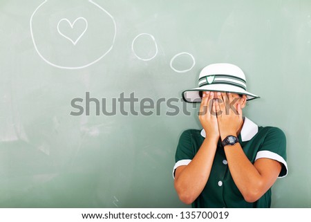 shy high school student fantasizing about love in classroom