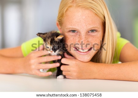 preteen girl with her pet friend closeup portrait