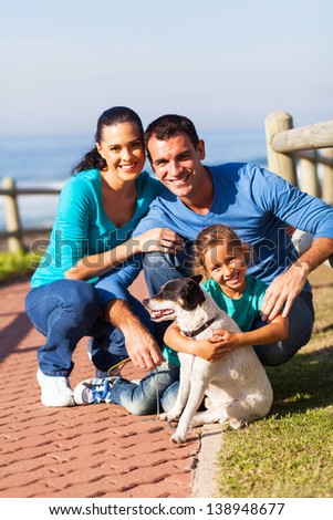 happy family family at the beach with pet dog