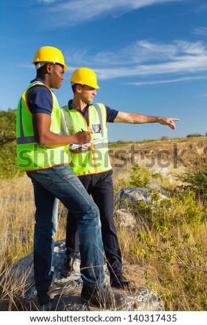 two male surveyors at work