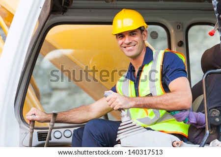 cheerful excavator operator on construction site