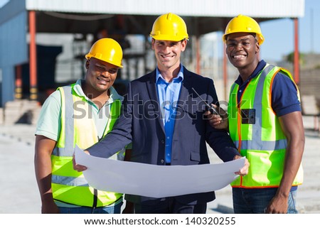 cheerful man architect team on construction site