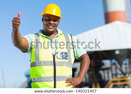 happy african construction worker giving thumb up