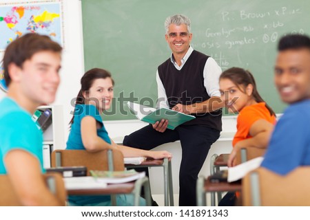 group of high school teacher and students in classroom