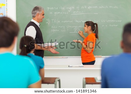 senior high school teacher teaching biology class