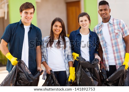 Cheerful Young Teenage Volunteers With Garbage Bag