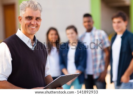 happy middle aged male high school teacher